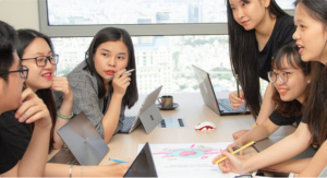 Team meeting with laptops in modern office.